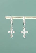 Load image into Gallery viewer, Platinum Shimmering Cross Huggie Earrings
